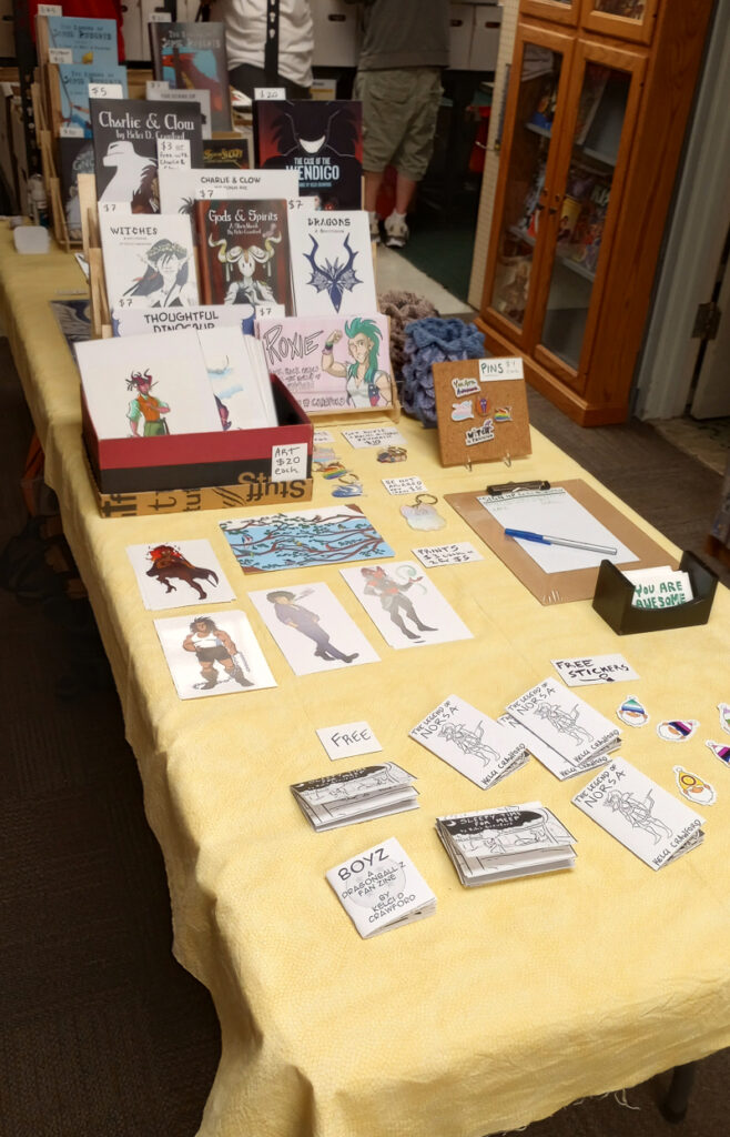 an artist alley table set up for Free Comic Book Day at the Toledo Game Room. 